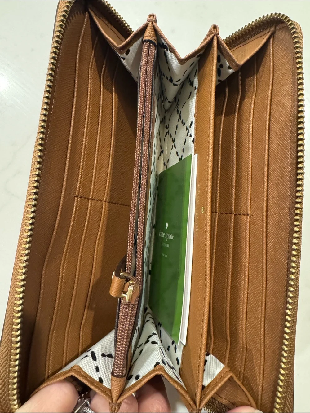 kate spade saffiano zip-around wallet in cognac brown with gold plaque